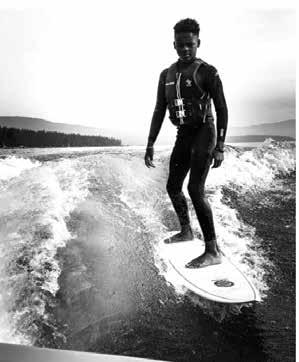 Black and white image of wake surfer